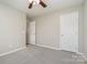 Bedroom featuring a ceiling fan, carpet, and two closets at 408 Harvest Ter, Clover, SC 29710