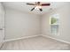 Bedroom boasts a ceiling fan and a window bringing in natural light at 408 Harvest Ter, Clover, SC 29710