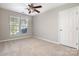 This bedroom has neutral carpet, ceiling fan and a window with bright natural light at 408 Harvest Ter, Clover, SC 29710