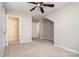 Large, bright bedroom has a ceiling fan, two doors and neutral carpeting at 408 Harvest Ter, Clover, SC 29710