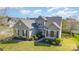 Charming two-story home with manicured lawn, gray siding, black shutters, and lush landscaping at 408 Harvest Ter, Clover, SC 29710