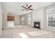 Spacious living area with fireplace flows into kitchen, creating an ideal space for entertaining at 408 Harvest Ter, Clover, SC 29710