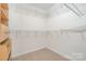 Walk-in closet features shelving and carpeted floor at 408 Harvest Ter, Clover, SC 29710