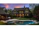 A lush backyard featuring a pool and outdoor bar area, perfect for entertaining guests at 4400 Sharon View Rd, Charlotte, NC 28226
