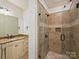 Well-appointed bathroom with a tiled glass shower, vanity with granite countertop, and modern fixtures at 4400 Sharon View Rd, Charlotte, NC 28226