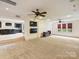 Spacious bonus room featuring recessed lighting, ceiling fans, and windows with a walk-up to the lower level basement bar at 4400 Sharon View Rd, Charlotte, NC 28226