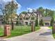 Beautiful home with manicured lawn, wrought iron fence and attached garage at 4400 Sharon View Rd, Charlotte, NC 28226