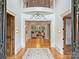 Grand foyer with high ceilings, detailed trim, and hardwood floors at 4400 Sharon View Rd, Charlotte, NC 28226