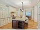 Custom kitchen with granite countertops, large island and hardwood floors at 4400 Sharon View Rd, Charlotte, NC 28226
