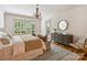 Main bedroom with large window and sitting area at 4400 Sharon View Rd, Charlotte, NC 28226