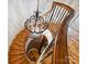 Elegant spiral staircase with hardwood steps, detailed iron railing, and decorative light fixture at 4400 Sharon View Rd, Charlotte, NC 28226