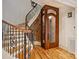 Staircase with iron railing, wood steps and an elevator at 4400 Sharon View Rd, Charlotte, NC 28226