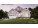 Charming single-Gathering home featuring a modern facade, lush lawn, and a two-car garage at 47 Creek Bridge Cir # 47, Charlotte, NC 28213