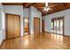 Spacious bedroom featuring hardwood floors, neutral walls, wooden ceiling, closets and a door to the patio at 477 Big Indian Loop, Mooresville, NC 28117