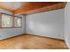 Bright bedroom featuring hardwood floors, neutral walls, wooden ceiling and a large window at 477 Big Indian Loop, Mooresville, NC 28117
