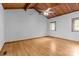 Spacious bedroom featuring hardwood floors, neutral walls, wooden ceiling, fan, and large windows at 477 Big Indian Loop, Mooresville, NC 28117