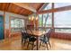 Dining area with wood floors, a vaulted ceiling and lake views through large windows at 477 Big Indian Loop, Mooresville, NC 28117
