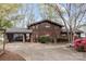 Charming two-story waterfront home with a covered carport and mature trees at 477 Big Indian Loop, Mooresville, NC 28117