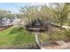 Lakefront home featuring a deck, A-frame architecture, walkway to the water, and mature trees at 477 Big Indian Loop, Mooresville, NC 28117