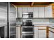 Close up view of stainless steel oven and microwave and counter space at 477 Big Indian Loop, Mooresville, NC 28117