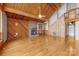 Open living area with vaulted wood ceilings, fireplace, and hardwood floors at 477 Big Indian Loop, Mooresville, NC 28117