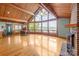 Spacious living room with fireplace and view of the lake at 477 Big Indian Loop, Mooresville, NC 28117