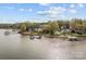 Scenic waterfront homes with private docks and well-maintained landscaping and mature trees at 477 Big Indian Loop, Mooresville, NC 28117
