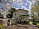 Spacious backyard with lawn, shed, and partial view of the home's exterior, great for outdoor enjoyment at 4927 Curtiswood Dr, Charlotte, NC 28213