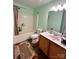 This bathroom features a vanity, mirror and shower-tub combo at 4927 Curtiswood Dr, Charlotte, NC 28213