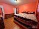 Bedroom with hardwood floors and a cozy atmosphere at 4927 Curtiswood Dr, Charlotte, NC 28213