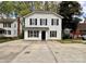 Charming two-story home with black shutters and a spacious concrete driveway at 4927 Curtiswood Dr, Charlotte, NC 28213