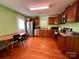 Bright eat-in kitchen with stainless steel appliances and hardwood floors at 4927 Curtiswood Dr, Charlotte, NC 28213