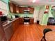 Eat-in kitchen with wood cabinets and stainless steel appliances at 4927 Curtiswood Dr, Charlotte, NC 28213