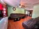 Cozy living room with hardwood floors and comfortable sectional seating at 4927 Curtiswood Dr, Charlotte, NC 28213