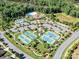 Aerial view of the community pool and tennis courts in a wooded area at 4989 Samoa Ridge Dr, Lancaster, SC 29720