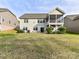 Large backyard with a well-maintained lawn and a charming patio area at 4989 Samoa Ridge Dr, Lancaster, SC 29720