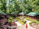 Exterior view of cozy cabins surrounded by lush trees and walking paths at 4989 Samoa Ridge Dr, Lancaster, SC 29720