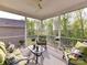 Relaxing screened-in porch with comfortable seating, perfect for enjoying the outdoors at 4989 Samoa Ridge Dr, Lancaster, SC 29720