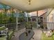 Inviting screened-in porch with comfortable seating and a tranquil view of the surrounding landscape at 4989 Samoa Ridge Dr, Lancaster, SC 29720