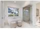Bright, modern bathroom with a standalone tub and glass-enclosed shower at 510 Poindexter Dr, Charlotte, NC 28209