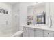 Modern bathroom featuring a glass-enclosed shower, white subway tile, and a stylish vanity with ample counter space at 510 Poindexter Dr, Charlotte, NC 28209