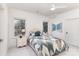 Bright bedroom with large windows, a ceiling fan, and a comfortable bed with stylish bedding, plus bedside tables at 510 Poindexter Dr, Charlotte, NC 28209