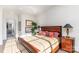 Sunlit bedroom featuring hardwood floors, a cozy bed, and natural light at 510 Poindexter Dr, Charlotte, NC 28209