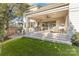 Stunning covered patio featuring ample seating and a seamless transition to the outdoor green space at 510 Poindexter Dr, Charlotte, NC 28209