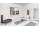 Bright home gym featuring a large window, neutral carpeting, and mirrored wall, offering a serene workout space at 510 Poindexter Dr, Charlotte, NC 28209