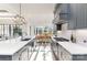 Beautiful kitchen with an island and cooktop overlooking the dining room at 510 Poindexter Dr, Charlotte, NC 28209