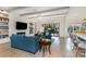 Bright living room featuring a fireplace, built-in shelving, and access to the patio at 510 Poindexter Dr, Charlotte, NC 28209