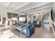 Open-concept living room with a fireplace, built-in shelves, and staircase access at 510 Poindexter Dr, Charlotte, NC 28209