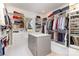 Spacious walk-in closet with custom shelving, drawers, and ample storage space at 510 Poindexter Dr, Charlotte, NC 28209