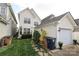 Charming backyard features lush grass, stone pathway, and access to the two car garage at 5121 Alysheba Dr, Indian Trail, NC 28079